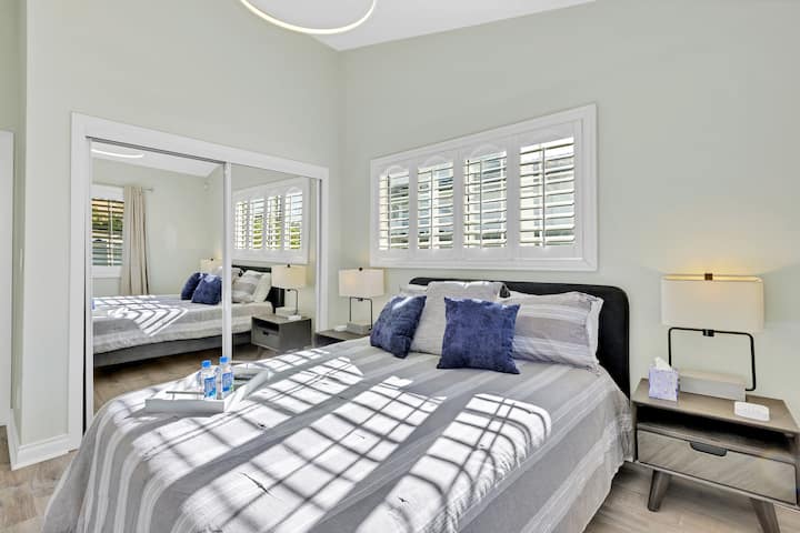 Soothing space! Our spacious bedroom is designed for relaxation, with a cozy bed, TV, and beautiful natural light, ensuring a peaceful night's sleep.