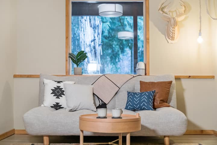 Head downstairs to the basement to cozy up and watch a movie on the projector. This couch also folds down.