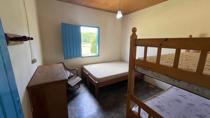 Room 1: Double bed and a bunk bed.