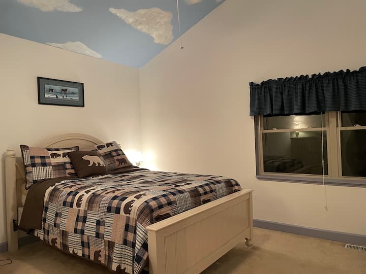 Let the clouds take you away... Upstairs bedroom with queen bed. Great view of woods in back