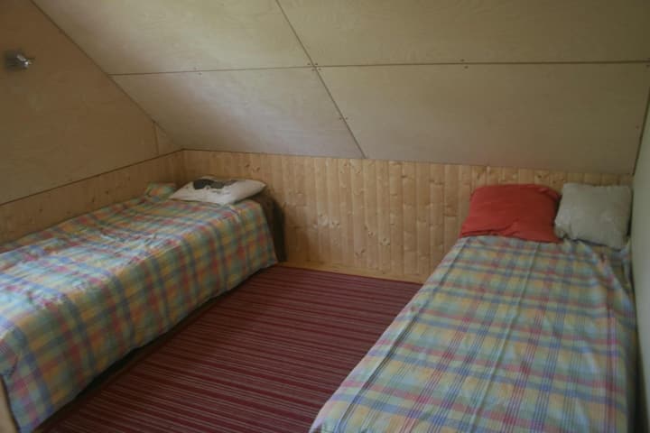 Upstairs bedroom 1 has two single beds and a desk