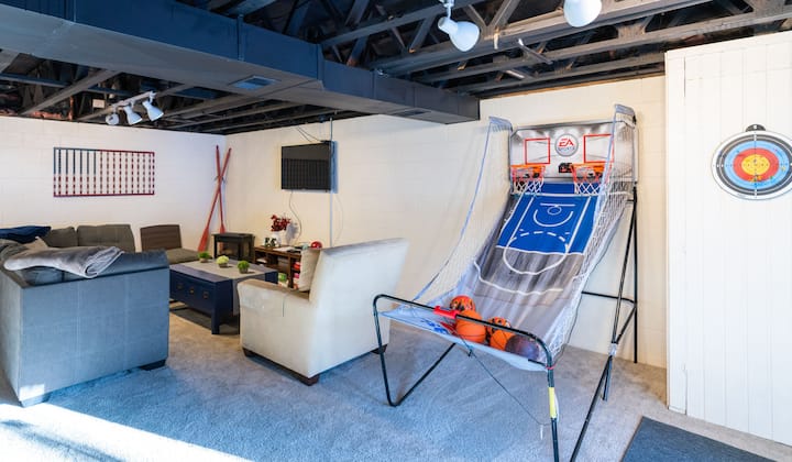 Basement Family Room with games, TV and queen bunks