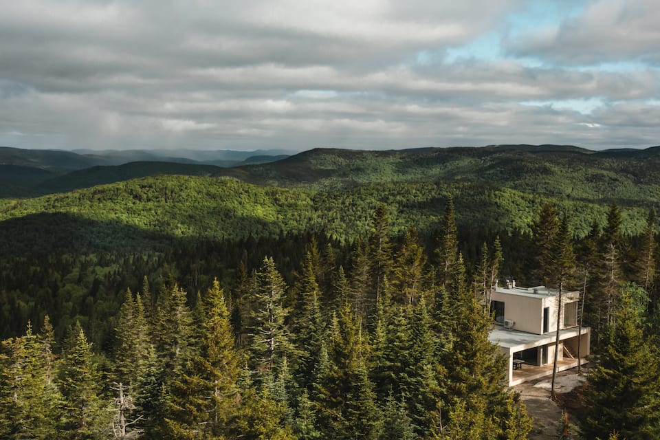 A glass tiny house on a mountaintop near Quebec City, Lac-Beauport, Quebec, Canada, photo 10 of 10