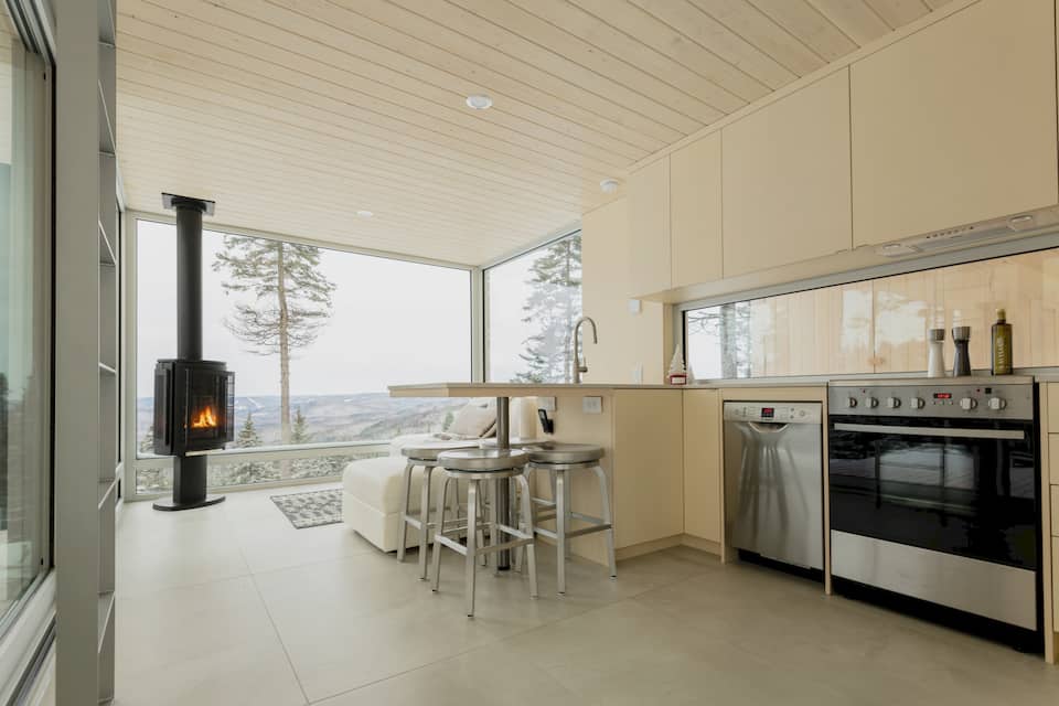 A glass tiny house on a mountaintop near Quebec City, Lac-Beauport, Quebec, Canada, photo 4 of 10