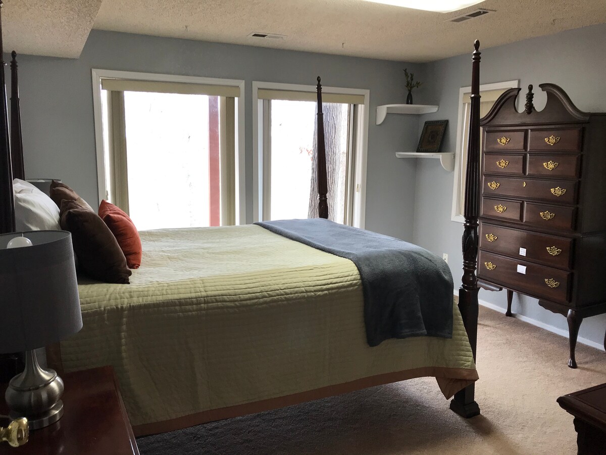 This bedroom has 2 large windows for more light and gives a great view of vegetation and animal activity.