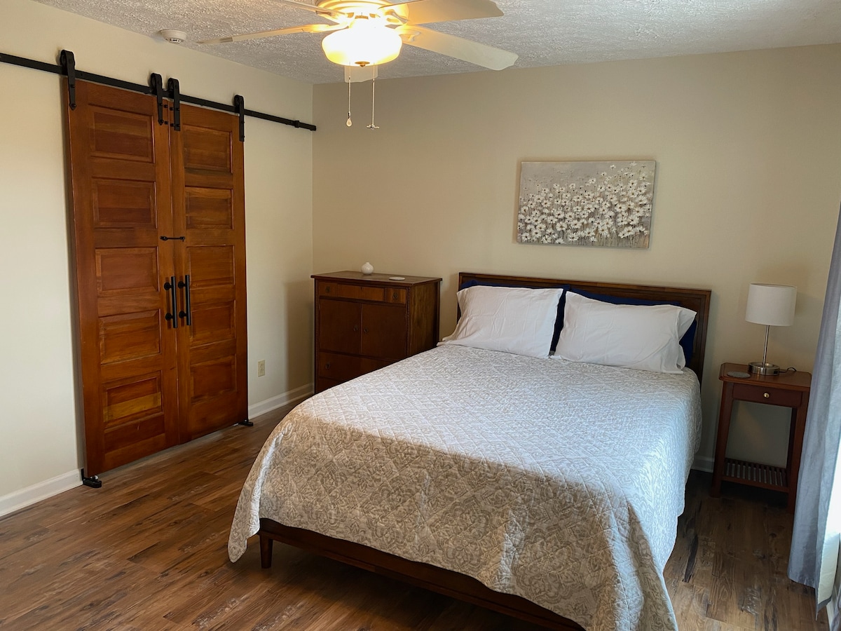 It has a queen bed with sliding doors to open into bedroom 4 if needed to make a family suite.  It shares a hallway with a bathroom between it and bedroom 2.