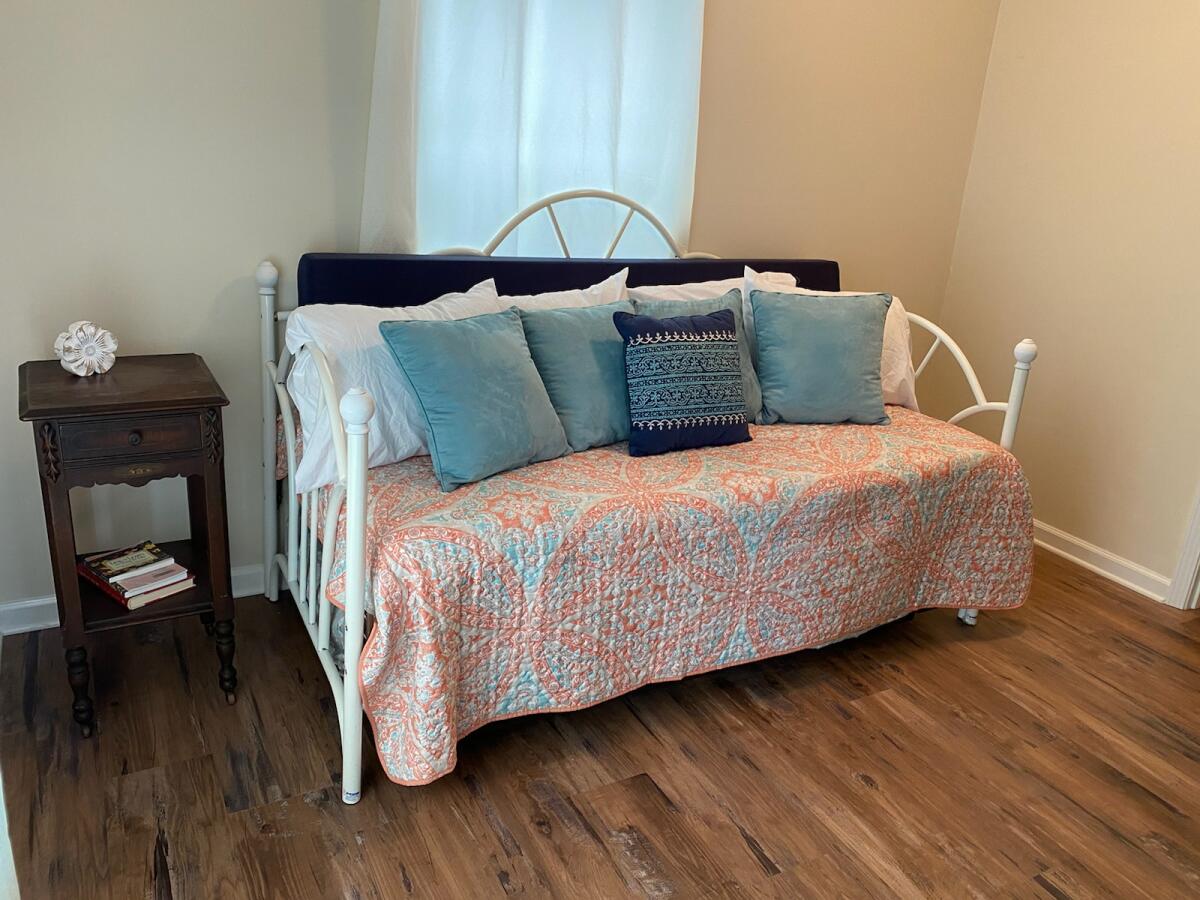 Has a twin trundle bed, a Roku tv, and toys for children.  It has shares a hallway with a bathroom between this room and bedroom 3.