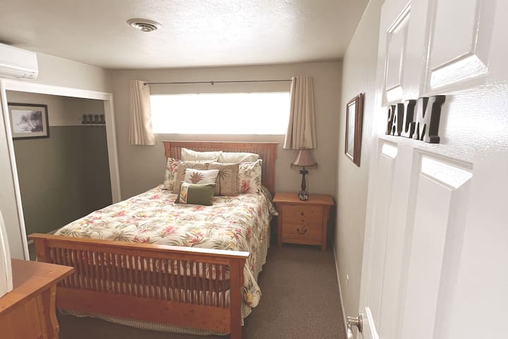 The Palm room with Queen bed and a crib, and split air heat and air conditioning with remote control.
