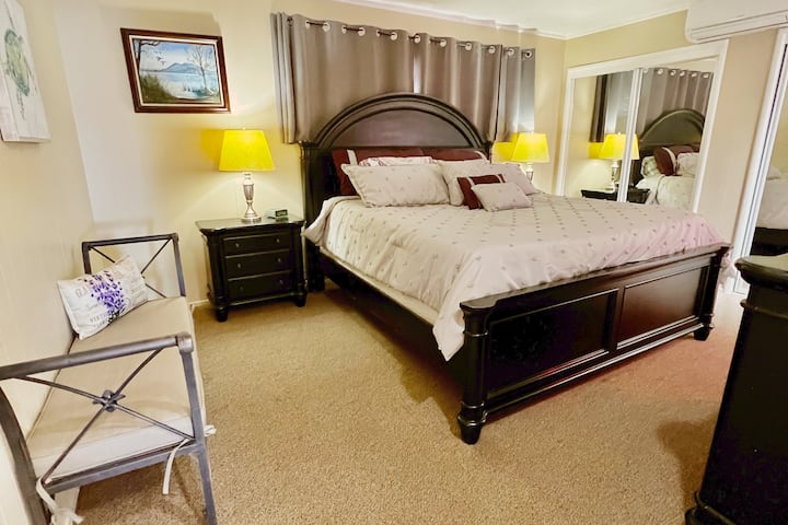 Master Bedroom with a King-size luxury bed and remote for personal heat and air conditioning. 