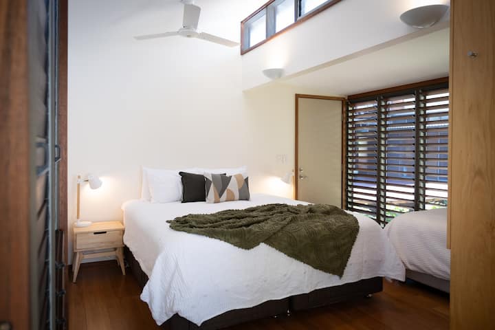 Bedroom 2 - King bed with private balcony plus one single bed. King bed can be separated into 2 X king singles. Therefore 3 beds in the room!