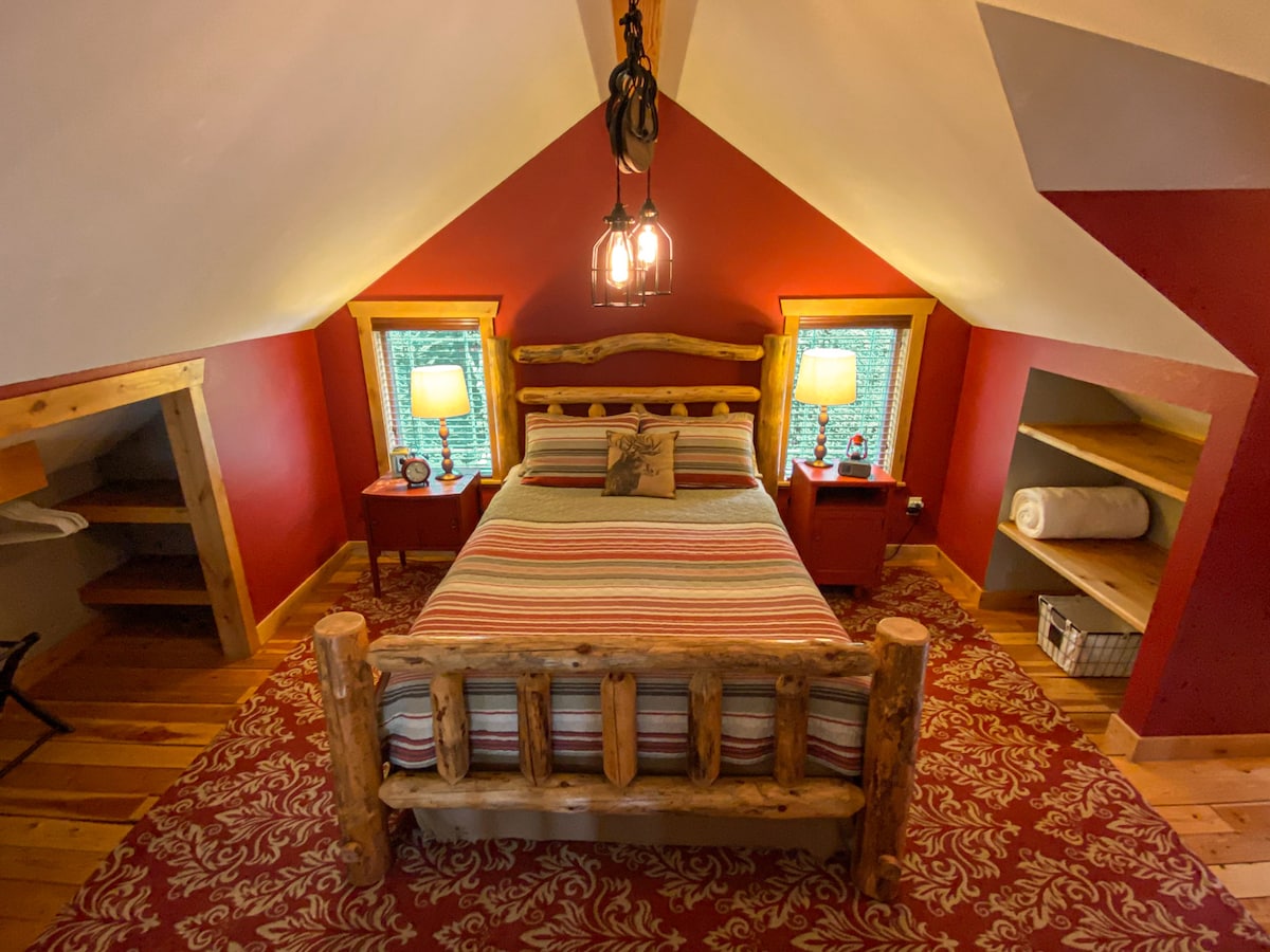 Cozy up on the queen bed in the loft bedroom.