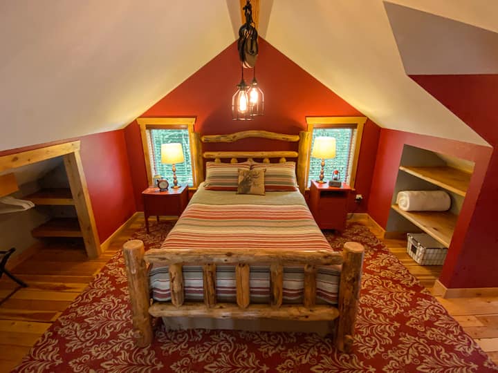 Cozy up on the queen bed in the loft bedroom.