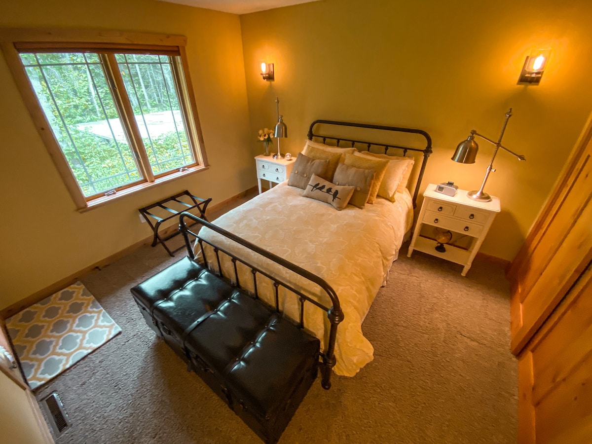 Main level bedroom with queen bed.