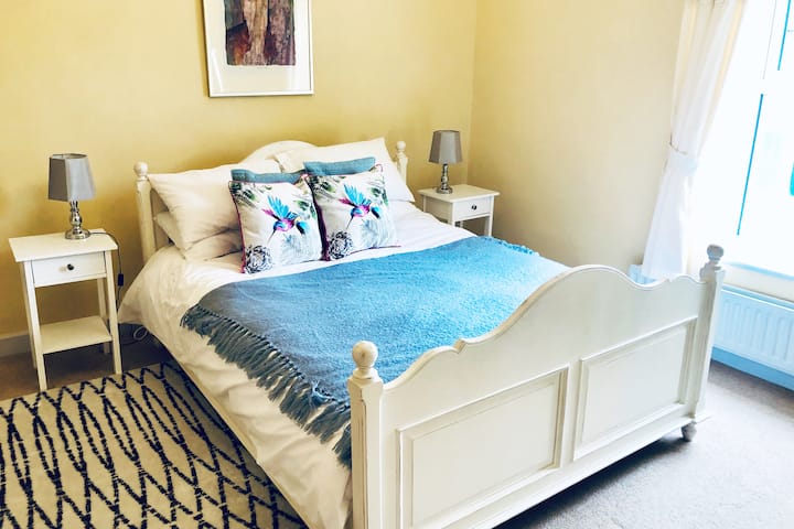 The master bedroom has a king sized bed, large wardrobe, luggage rack, bedside tables, mirrors and a dressing table.