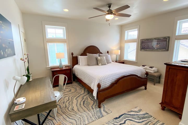 Master suite with king bed, workspace (just in case) fresh paint, and a beautifully remodeled bath for 2023 