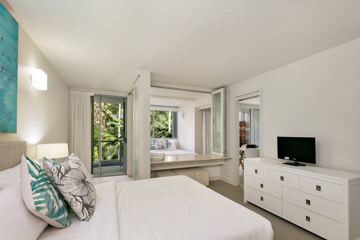 Rest well in the master bedroom with a queen bed, TV, ensuite and access to a second balcony.