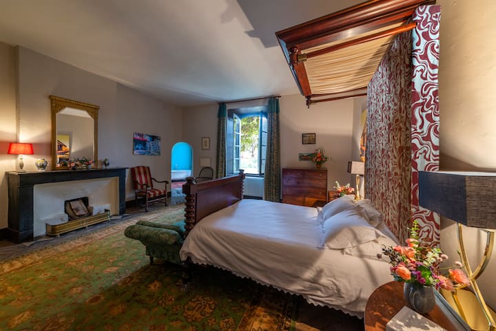 Bedroom #2, spacious, complete with a majestic double bed and a sophisticated en-suite claw-footed bath, offers a stately retreat infused with château elegance.
