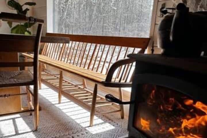 Bench and wood stove with cast iron kettle we use as a humidifier in the winter