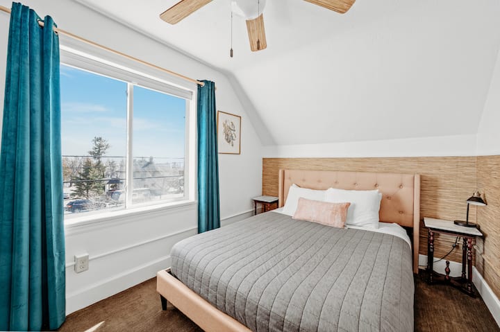 Bedroom #1, with new queen size organic mattress. Lake Superior views can been seen through the trees. 