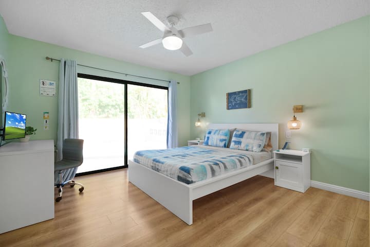 A king bed with a private workstation