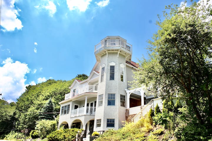 A Maine vacation rental in a converted lighhouse on a sunny day