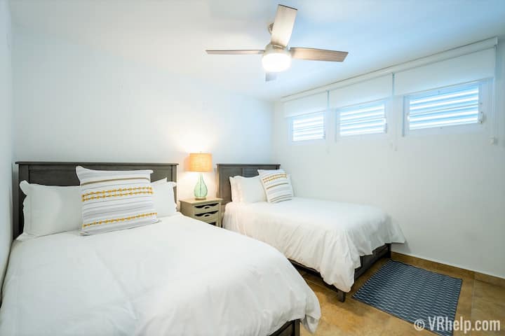 The second bedroom features two full beds.