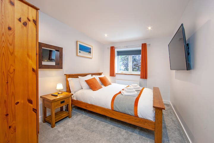 Main bedroom with big TV 