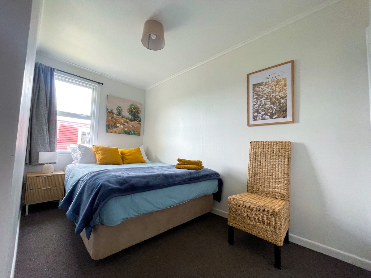 Smaller room, showing queen bed.