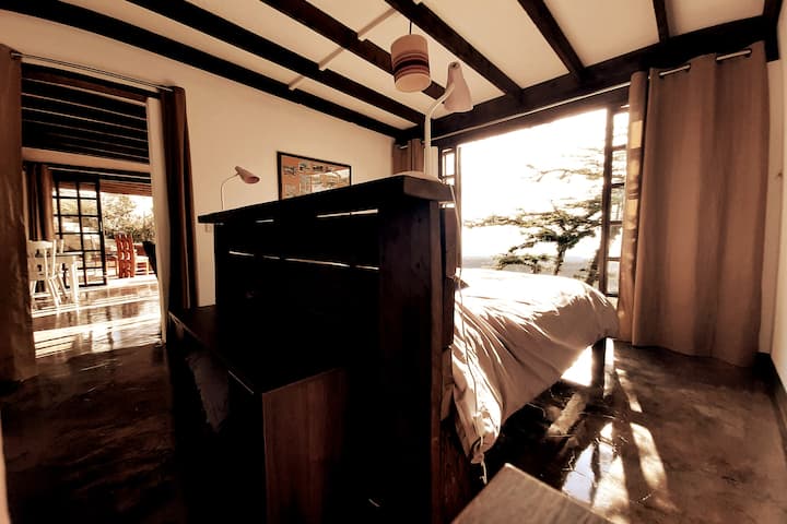 The bedroom doors open fully bringing the Rift Valley countryside and amazing views into the bedroom.