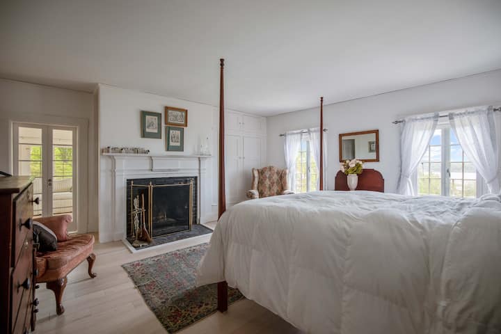 Queen size bed with fireplace, private bath on second floor