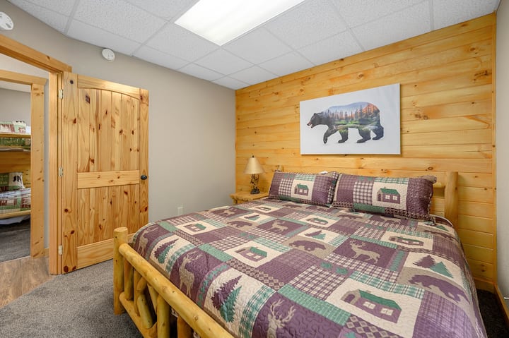 Bedroom 2 on the lower level with hand carved, log frame King bed!