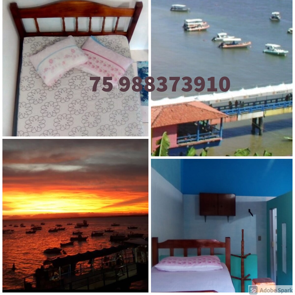 A cozy sleeping area showcases a simple wooden bed adorned with floral-patterned bedding. A vibrant blue wall complements the space, while a serene sunset view is visible through a nearby window, illuminating a peaceful harbor dotted with boats.