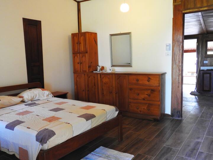 main room, with 1 double bed and ceiling fan