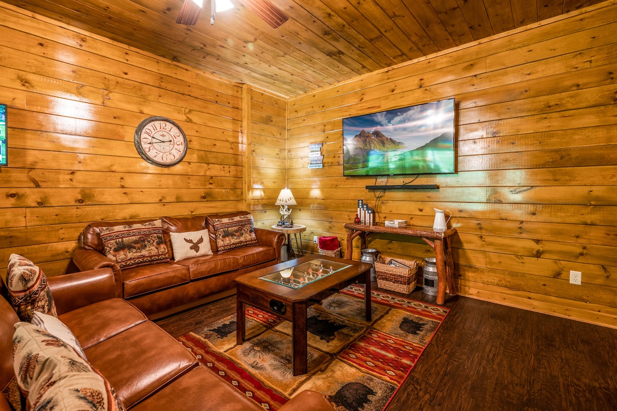 Downstairs TV / Movie Room with custom foosball coffee table
One of the couch is replaced with two leather swivel chairs