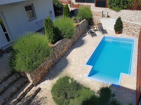 Successful Airbnb property: Cosy Apartment with a Pool and a nice Patio in Žedno