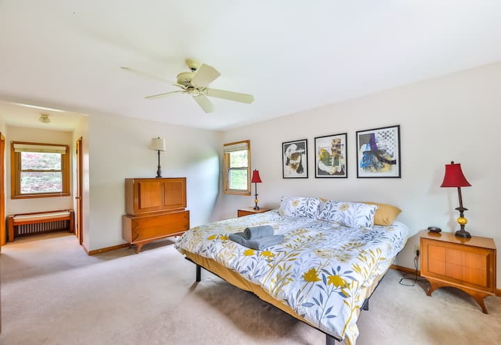 Master bedroom with gorgeous mid-century furniture and a king size reclining bed