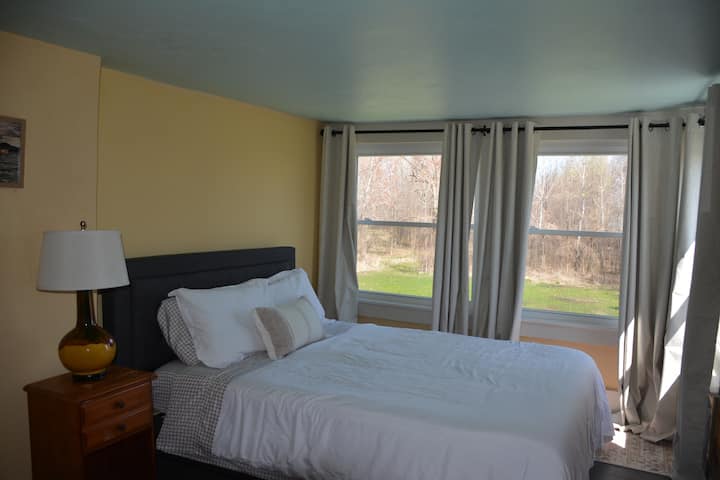 The Western Room has several large windows to allow for a maximum amount of sunlight. Equipped with a lamp for some late-night reading, you'll be very cozy!
