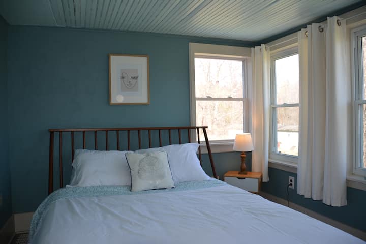 The Blue Room is a cozy room with a water feel. It has 3 large windows that allow you to wake up to the sun.