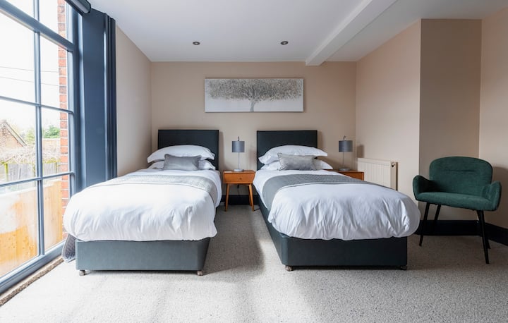 Downstairs bedroom with en suite, guests can request a King size bed or 2 singles.