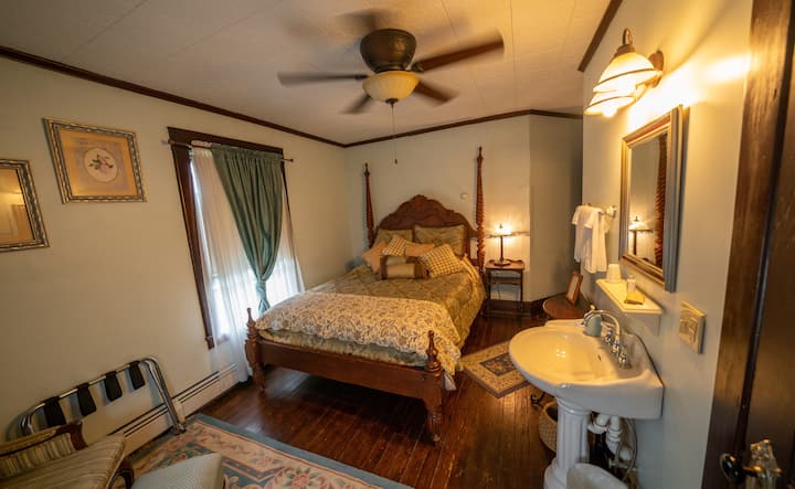 Another view, Youghiogheny River Bedroom  with queen bed, AC window unit, ceiling fan and private bathroom.