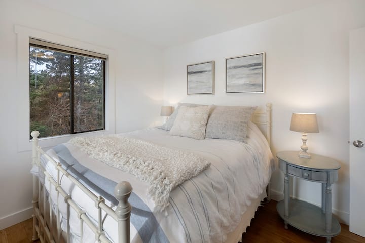 Bedroom #1: Upstairs. This room has a queen sized bed with phenomenal water views. 