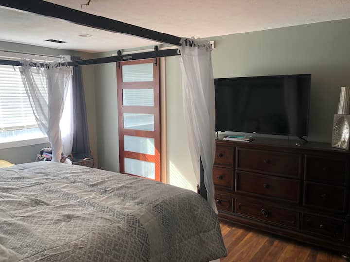 Spacious Master Bedroom with Walk-In Closet and 50" TV