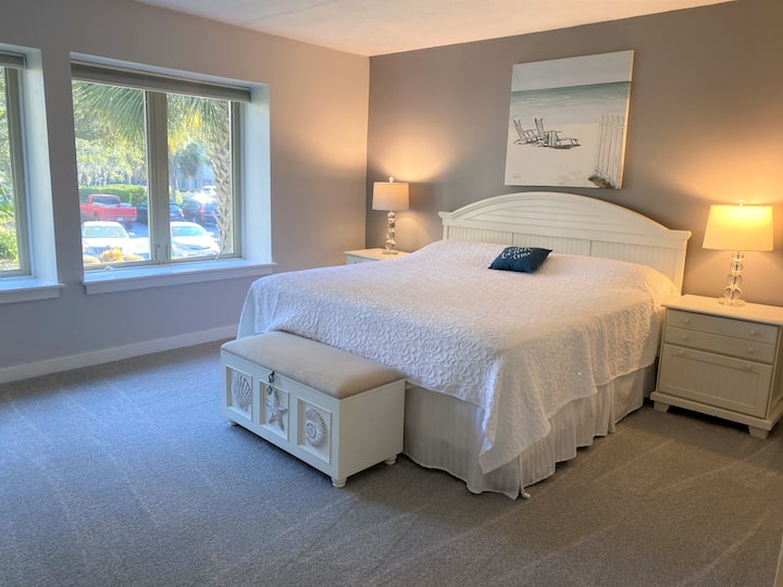 Master bedroom luxurious new carpeting and 50" smart tv