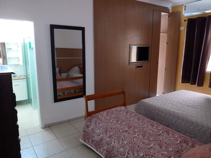 Room with queen-size bed and en-suite bedroom.