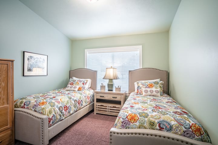 Twin bedroom.
Within the closet or armoire, you will find extra beach towels, blankets, pillows, folding chairs, Pack & Play, and a twin-size blow-up bed with linens.