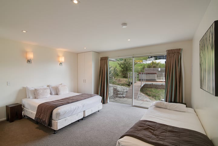 Our bedroom 3 with access to the outdoor deck and spa pool. 