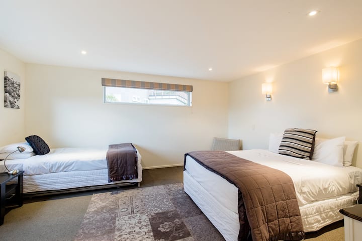 Our bedroom 5 with a queen bed and a single bed with trundle.