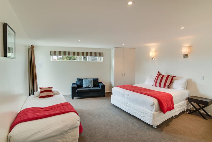 Our bedroom 6 with a king bed and a single bed, as well as a sofa. 