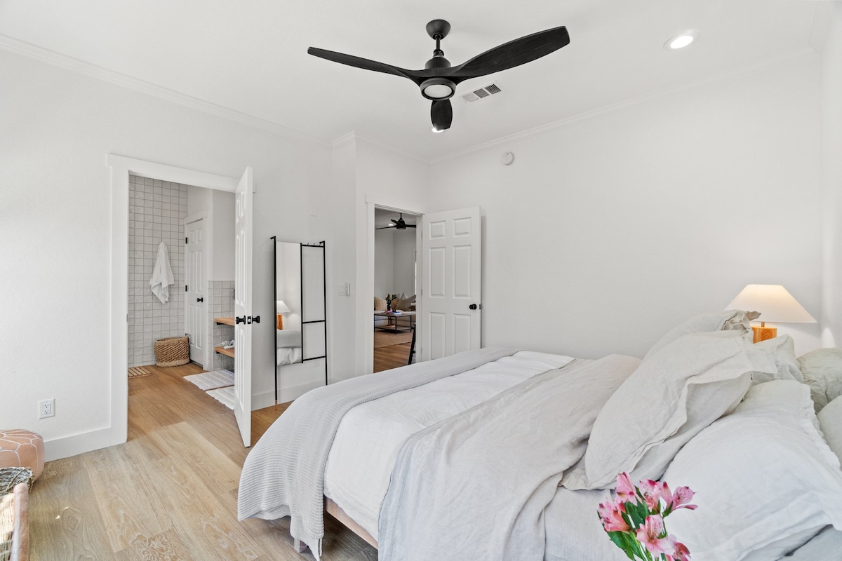 The master bedroom with a king sized bed and it's own bathroom