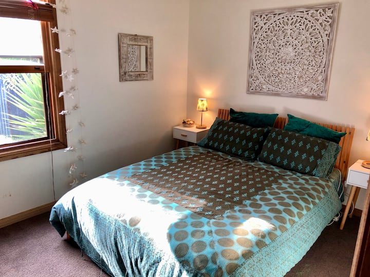 It's that light and airy middle bedroom again. Queen bed. 